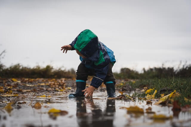 Child playing in the mud